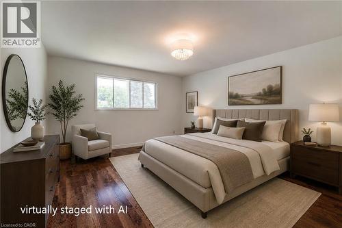 Spacious bedroom featuring rich wood-finish flooring, a contemporary semi-flush mount light fixture, and a wide window offering natural light - 109 White Oak Place, Waterloo, ON - Indoor Photo Showing Bedroom