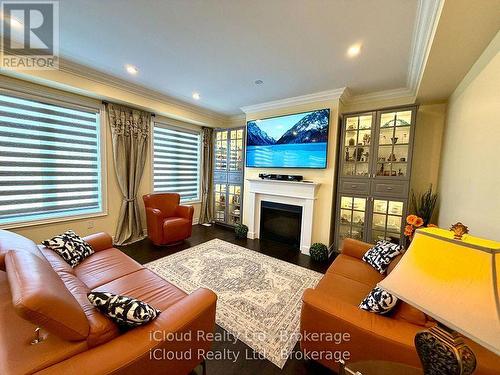 Family room with GAS fireplace & built-in shelving - 56 Esther Crescent, Thorold, ON - Indoor Photo Showing Living Room With Fireplace