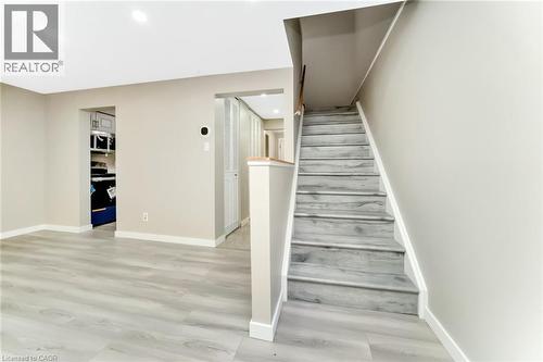 Light wood-finish flooring throughout, complemented by neutral wall tones - 53 Burns Drive, Guelph, ON - Indoor Photo Showing Other Room