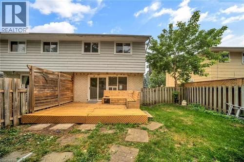 Expansive wood deck with an integrated bench seating area - 53 Burns Drive, Guelph, ON - Outdoor With Deck Patio Veranda