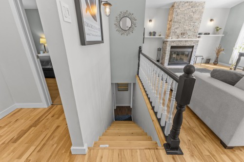 Escalier - 11 Rue Sunnyview, Morin-Heights, QC - Indoor Photo Showing Other Room With Fireplace