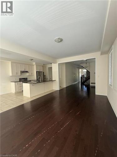 Expansive open-concept living area featuring dark wood-finish flooring - 63 Ridge Road, Cambridge, ON - Indoor