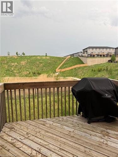 Expansive outdoor deck with natural wood flooring and coordinating wood railing - 63 Ridge Road, Cambridge, ON - Outdoor With Deck Patio Veranda