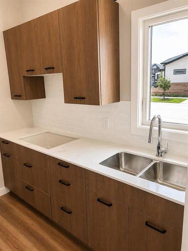 Spice Kitchen with extra pantry. - 2 Crocus Place, West St Paul, MB - Indoor Photo Showing Kitchen With Double Sink