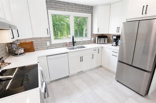 4 Schultz Rd, Pinawa, MB - Indoor Photo Showing Kitchen With Double Sink