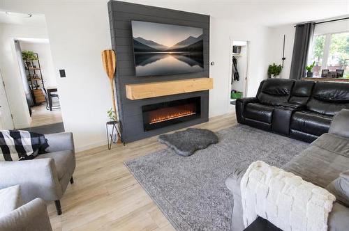 4 Schultz Rd, Pinawa, MB - Indoor Photo Showing Living Room With Fireplace