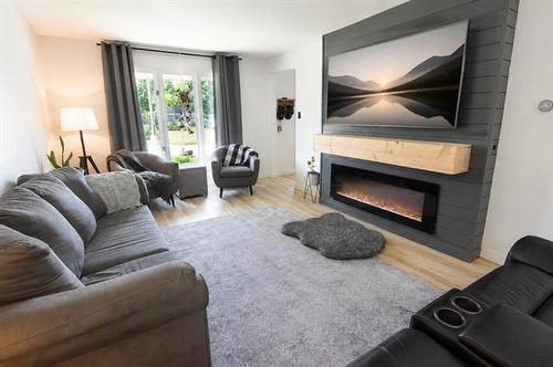4 Schultz Rd, Pinawa, MB - Indoor Photo Showing Living Room With Fireplace