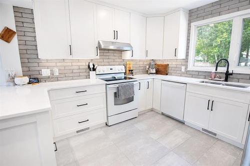 4 Schultz Rd, Pinawa, MB - Indoor Photo Showing Kitchen With Double Sink