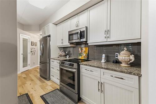 212 775 Sterling Lyon Parkway, Winnipeg, MB - Indoor Photo Showing Kitchen With Upgraded Kitchen