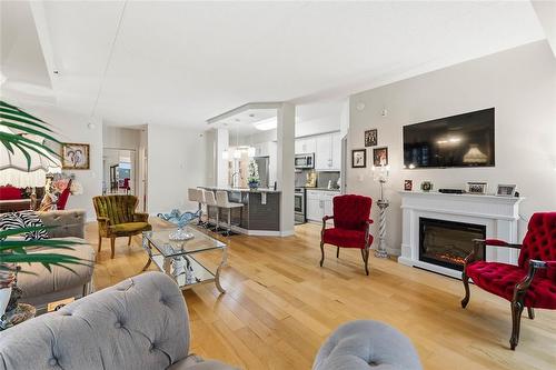 212 775 Sterling Lyon Parkway, Winnipeg, MB - Indoor Photo Showing Living Room With Fireplace
