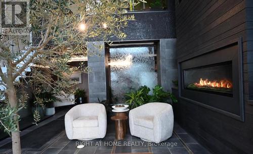 102 - 15 Kneeshaw Drive, Barrie, ON - Indoor Photo Showing Living Room With Fireplace
