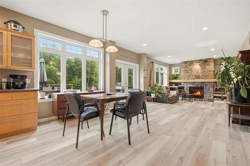 107 Hazel Ave, St Andrews, MB - Indoor Photo Showing Dining Room With Fireplace