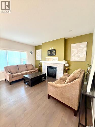 539 Secord Manor, Saskatoon, SK - Indoor Photo Showing Living Room With Fireplace