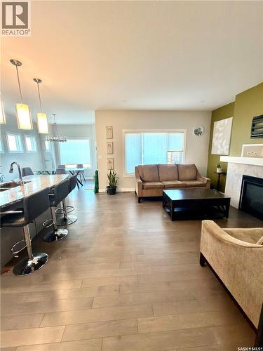 539 Secord Manor, Saskatoon, SK - Indoor Photo Showing Living Room With Fireplace