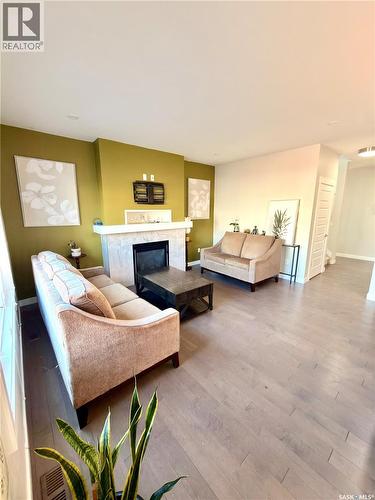 539 Secord Manor, Saskatoon, SK - Indoor Photo Showing Living Room With Fireplace