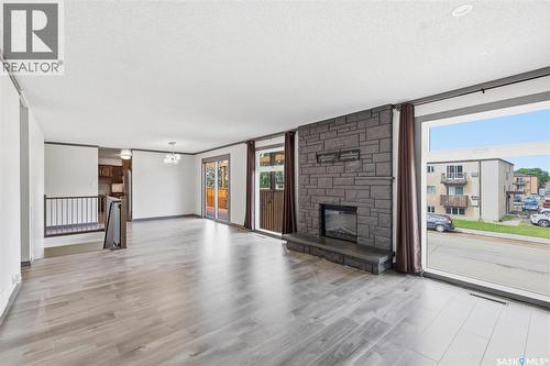 65 Rennie Place, Saskatoon, SK - Indoor Photo Showing Living Room With Fireplace