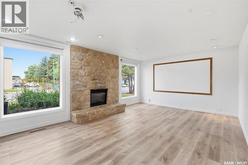 65 Rennie Place, Saskatoon, SK - Indoor Photo Showing Living Room With Fireplace