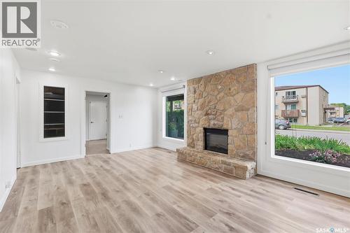 65 Rennie Place, Saskatoon, SK - Indoor Photo Showing Living Room With Fireplace