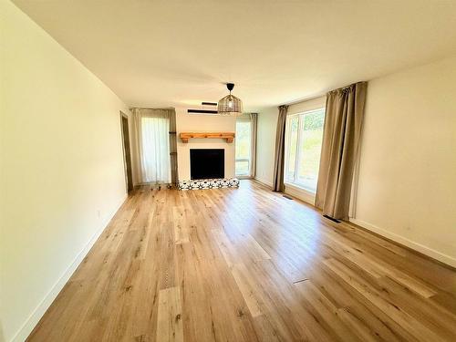 715 St Clair, Keewatin, ON - Indoor Photo Showing Living Room With Fireplace
