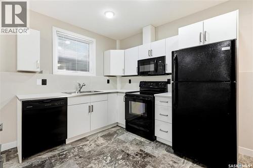 822 Werschner Court, Saskatoon, SK - Indoor Photo Showing Kitchen With Double Sink