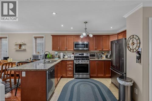 appliances included, dishwasher new, ceramic floor, granite countertop - 49 Millcroft Drive, Simcoe, ON - Indoor Photo Showing Kitchen With Double Sink