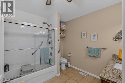 4pc tile floor grab bar granite counter top  shelving for towels - 49 Millcroft Drive, Simcoe, ON - Indoor Photo Showing Bathroom