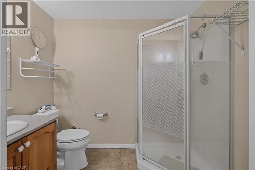 lower level 3pc bathroom ideal for overnight guests tile floor - 49 Millcroft Drive, Simcoe, ON - Indoor Photo Showing Bathroom