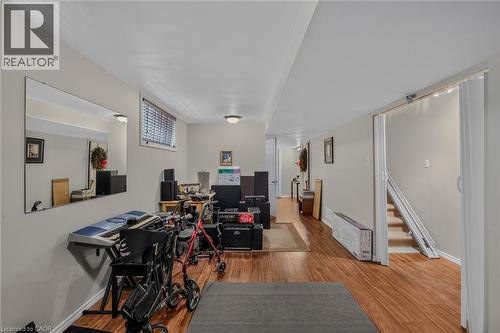 family room, laminate floor - 49 Millcroft Drive, Simcoe, ON - Indoor