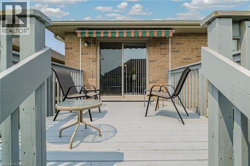 deck with retractable awning 10' x 10' well maintained yearly - 49 Millcroft Drive, Simcoe, ON - Outdoor With Exterior
