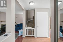 Stairs to 2nd level and door the basement - 