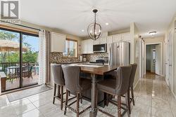 View of custom made breakfast bar & patio door. - 