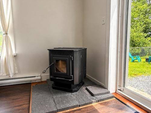14 River Street, Eureka, NS - Indoor Photo Showing Other Room With Fireplace