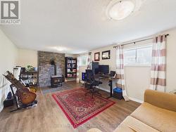 Family room - above grade windows, wood stove - 