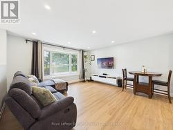 Living room w/ large bay window - 