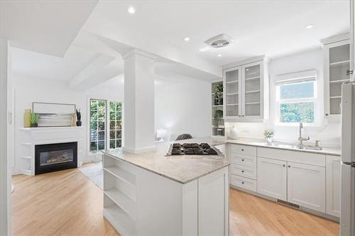 476 Ash St, Winnipeg, MB - Indoor Photo Showing Kitchen With Fireplace