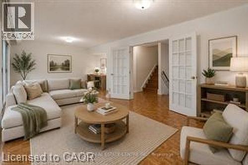 Living area featuring wood-finish flooring, white walls, and recessed lighting - 396 Pinemeadow Avenue, Mississauga, ON - Indoor Photo Showing Living Room