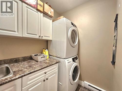 Suite laundry - 1494 Montenegro Drive, Kelowna, BC - Indoor Photo Showing Laundry Room