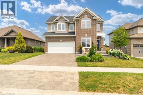 Two-story brick and siding residence with a paver driveway - 87 Boyd Boulevard, Thamesford, ON - Outdoor With Facade
