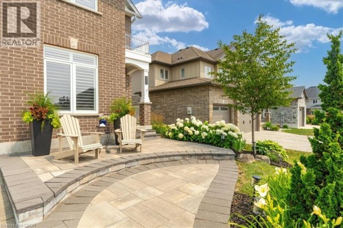 Brick facade featuring white trim windows with louvered shutters - 87 Boyd Boulevard, Thamesford, ON - Outdoor
