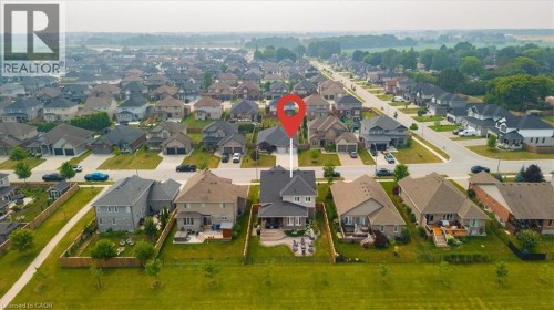 Aerial perspective showcasing a residential development with multiple single-family homes - 87 Boyd Boulevard, Thamesford, ON - Outdoor With View