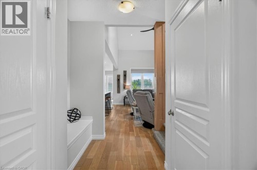 Hallway entry with light wood-finish flooring, vaulted ceilings, recessed lighting, and a built-in bench seat - 87 Boyd Boulevard, Thamesford, ON - Indoor Photo Showing Other Room