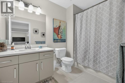 Contemporary bathroom featuring a single vanity with a white countertop and undermount sink - 87 Boyd Boulevard, Thamesford, ON - Indoor Photo Showing Bathroom