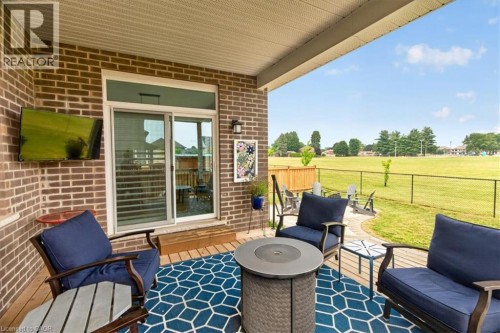 Covered patio featuring a brick exterior and a sliding glass door - 87 Boyd Boulevard, Thamesford, ON - Outdoor With Deck Patio Veranda With Exterior