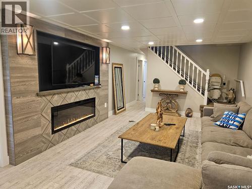 59 Snedden Crescent, Maple Bush Rm No. 224, SK - Indoor Photo Showing Living Room With Fireplace