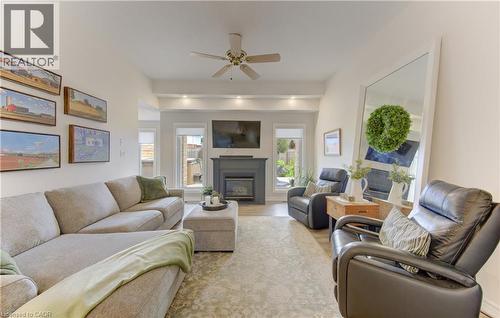 Bright living area featuring high ceilings, recessed lighting, and wood-finish flooring - 249 Dearborn Boulevard, Waterloo, ON - Indoor Photo Showing Living Room With Fireplace