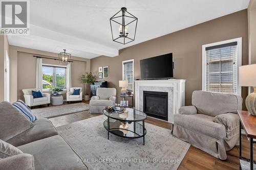 36 Beverly Street, Springwater, ON - Indoor Photo Showing Living Room With Fireplace