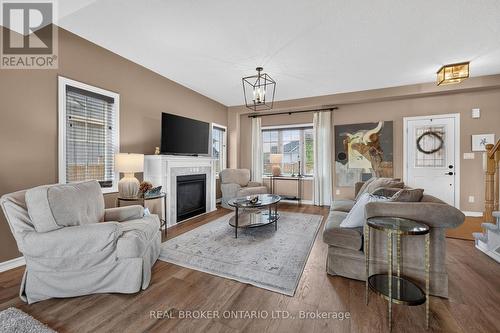 36 Beverly Street, Springwater, ON - Indoor Photo Showing Living Room With Fireplace