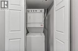 Washroom with estacked washer and dryer - 