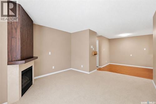 301 1121 1A Mckercher Drive, Saskatoon, SK - Indoor Photo Showing Other Room With Fireplace
