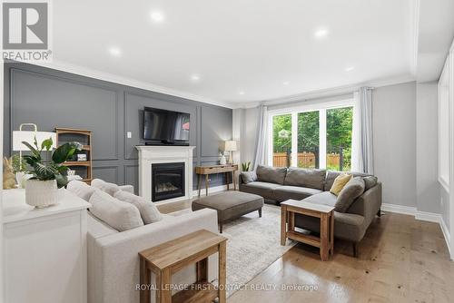 81 Trail Boulevard, Springwater, ON - Indoor Photo Showing Living Room With Fireplace